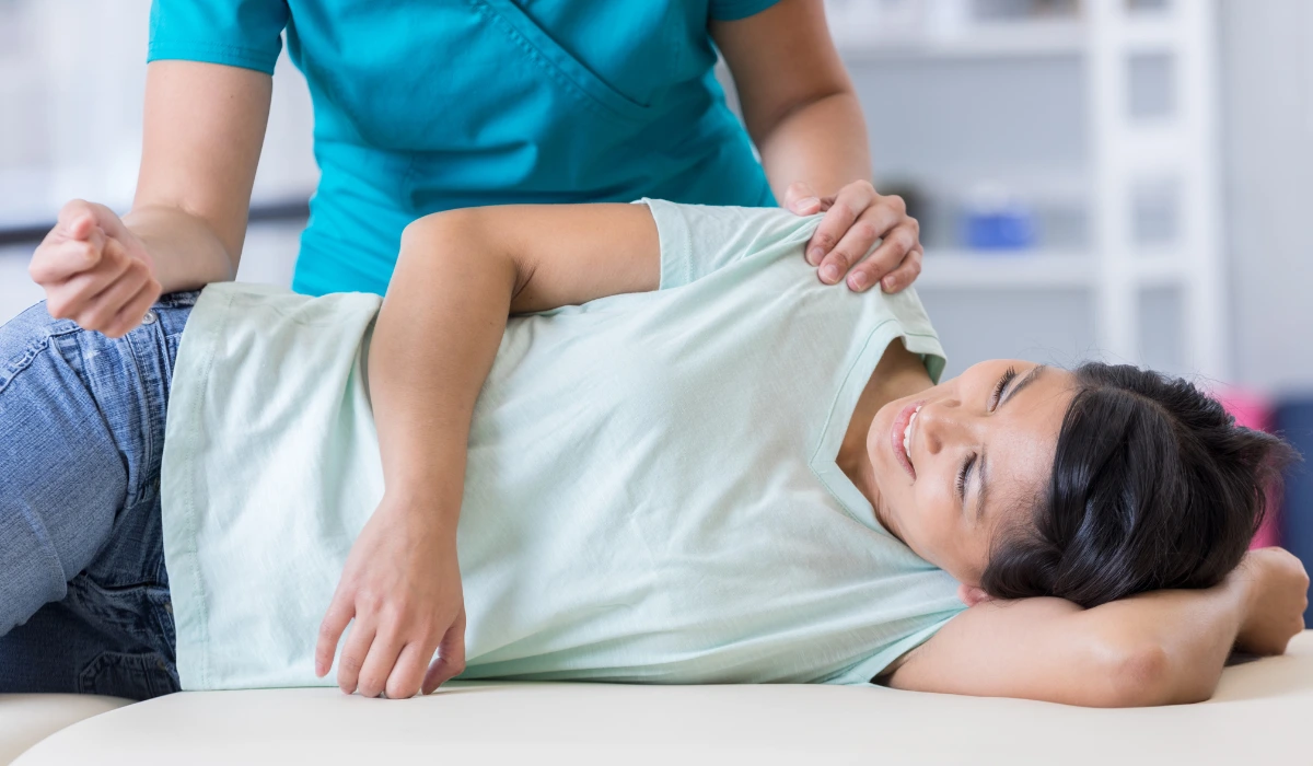 Chiropractor and patient